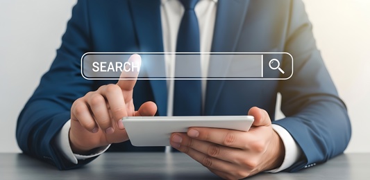 picture of a search bar on a laptop operated by a man