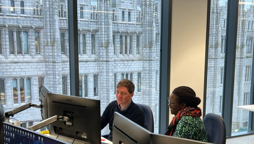 Two of NSTA staff at work in our Aberdeen office